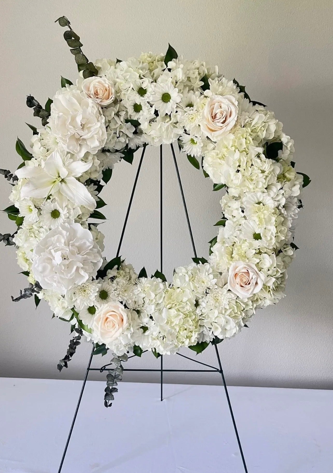 white lily funeral wreath All White Funeral Wreath with Stand